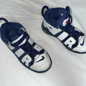Navy blue and white uptempos
